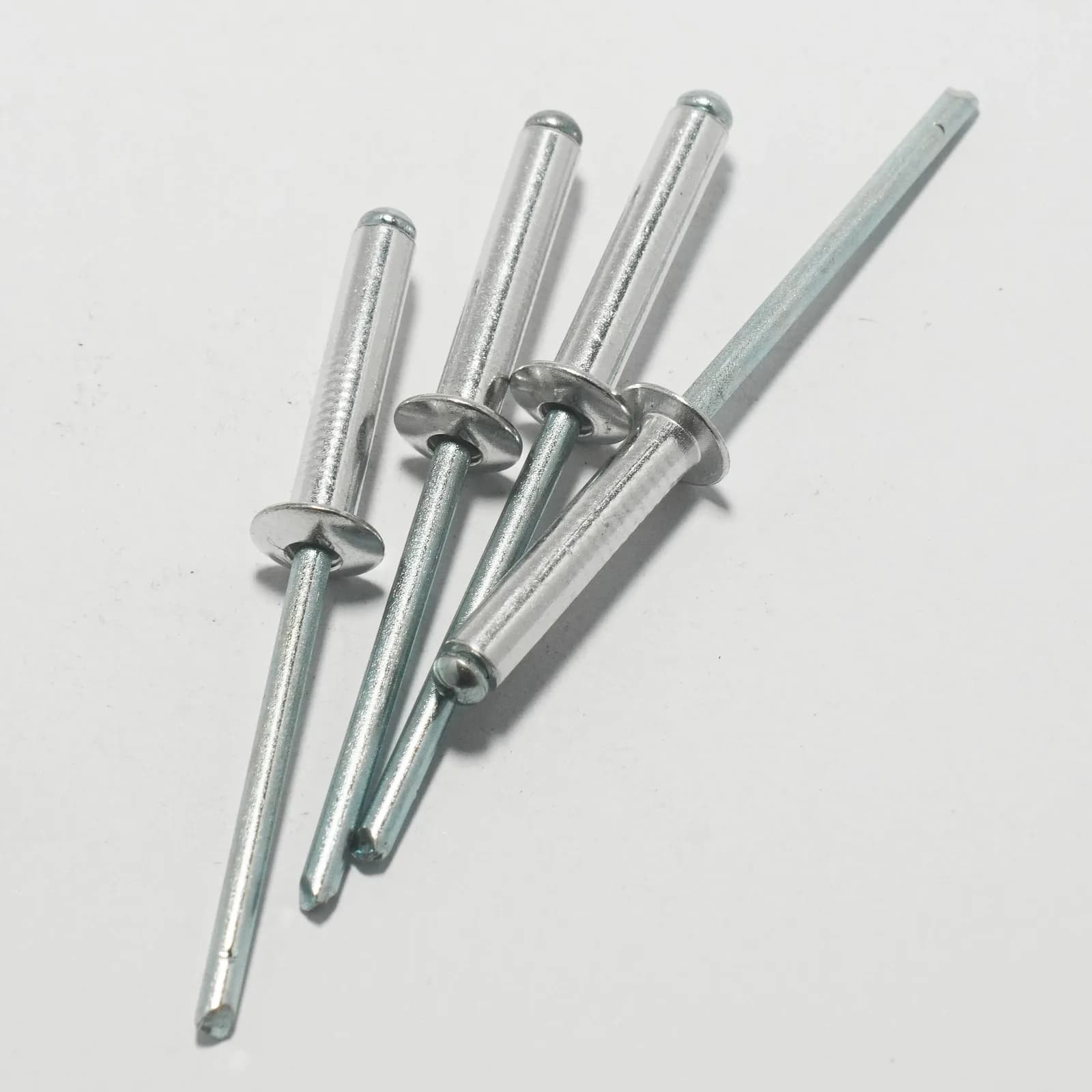 Stainless steel dome head blind rivets.